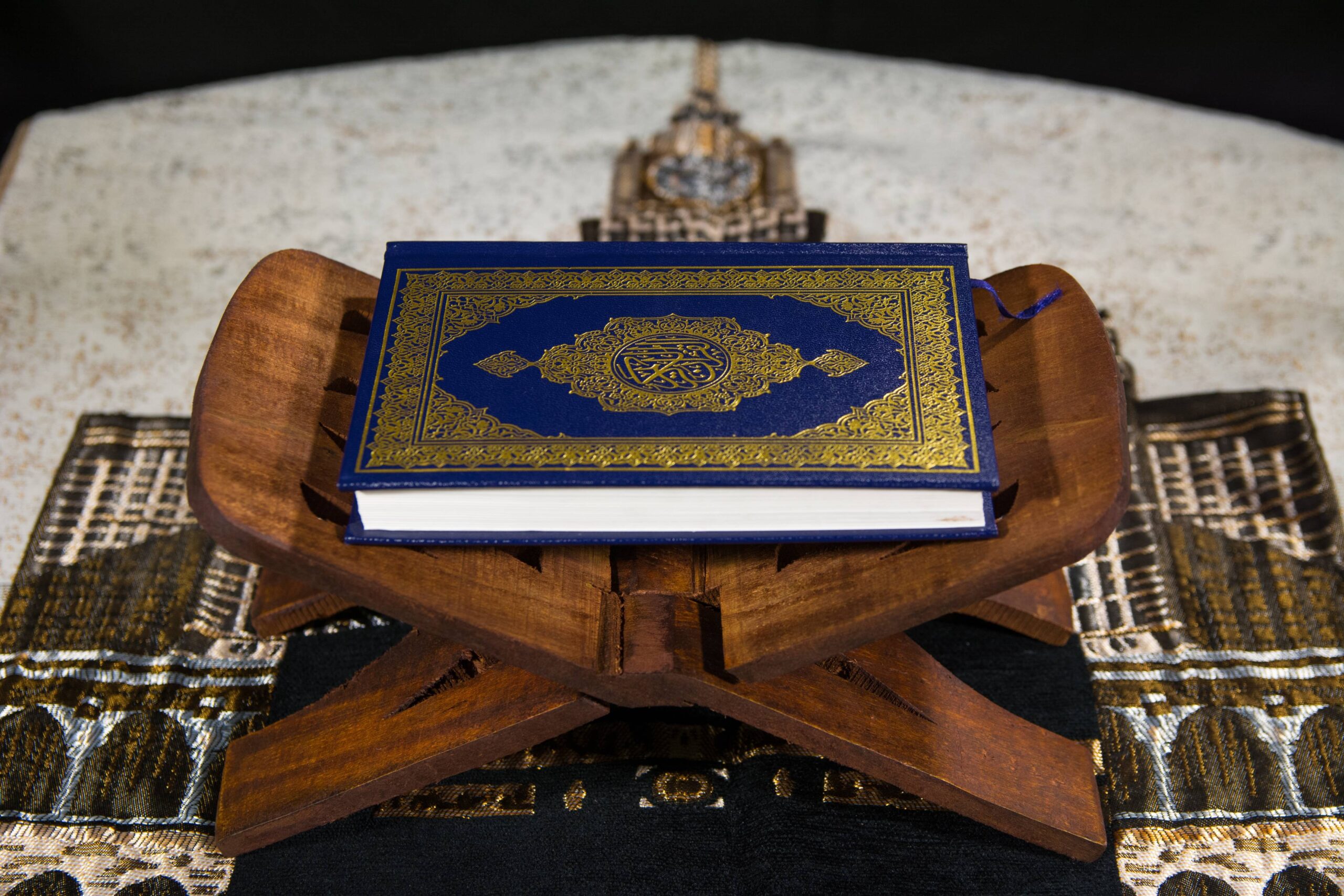 Reciting Quran with English transliteration